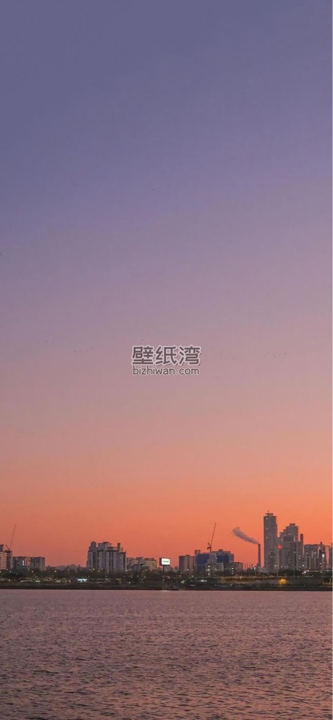 海边城市在日落时分的风景 手机壁纸