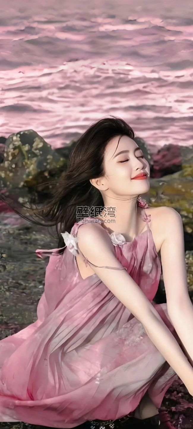 白鹿在海边岩石上穿着粉色连衣裙手机壁纸